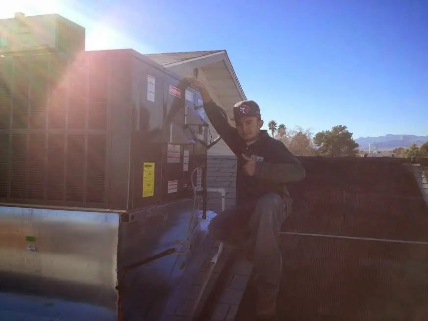 HVAC technician performing HVAC Inspection on a rooftop unit in El Cerrito